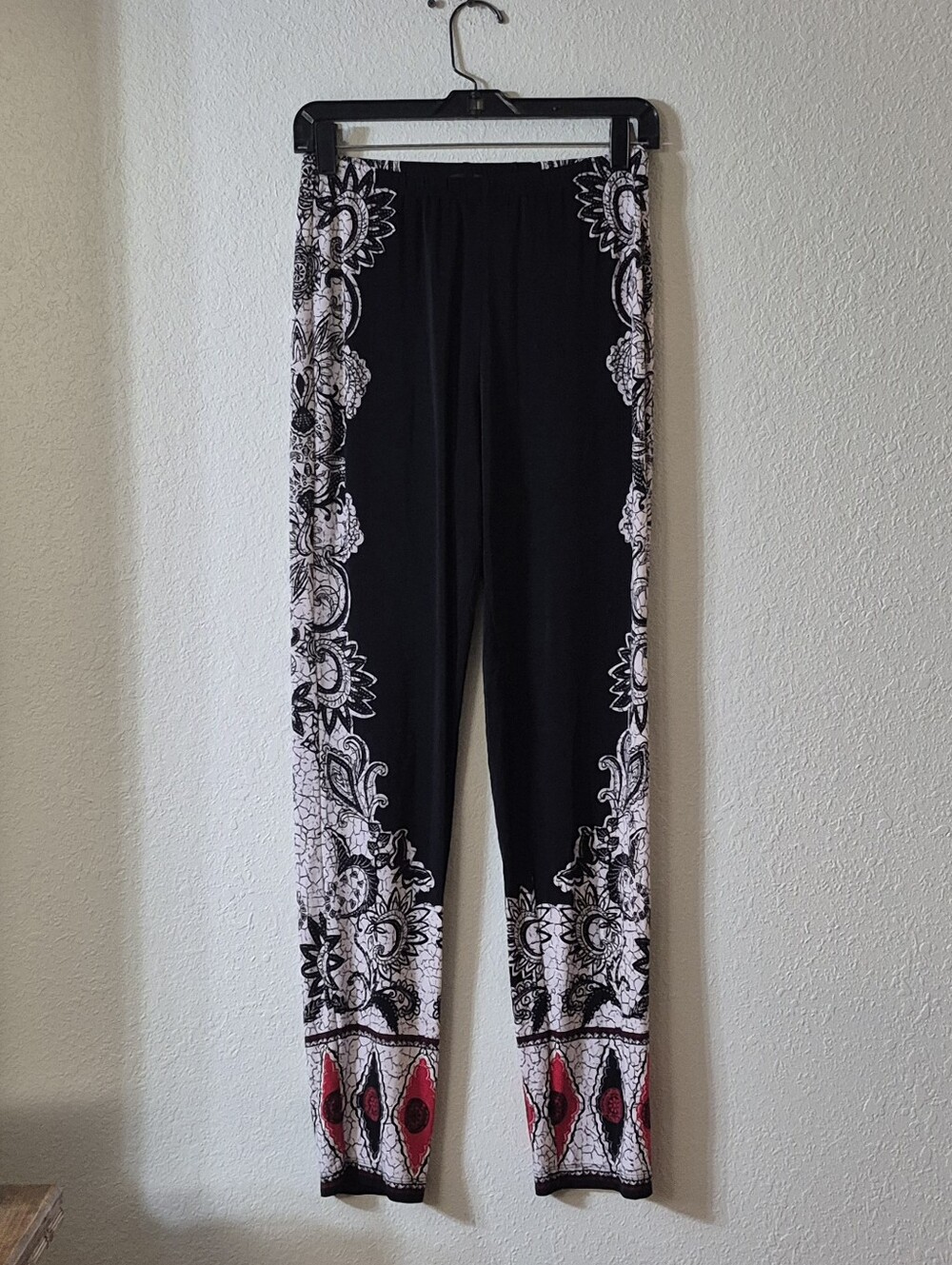 Black Floral Border Print Leggings with Red Hem Accents